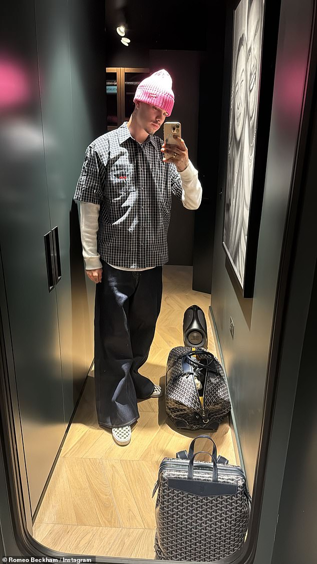 While dad David recovered at home, his son Romeo, 22, snapped a selfie donning a stylish ensemble including a pink beanie hat