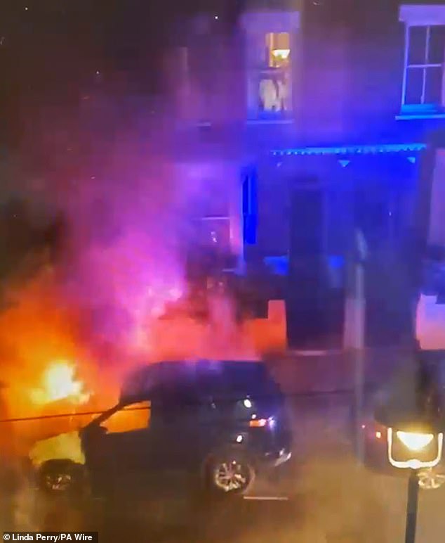 Firefighters tackling the burning car in the same north London street where Prime Minister Sir Keir Starmer has his property