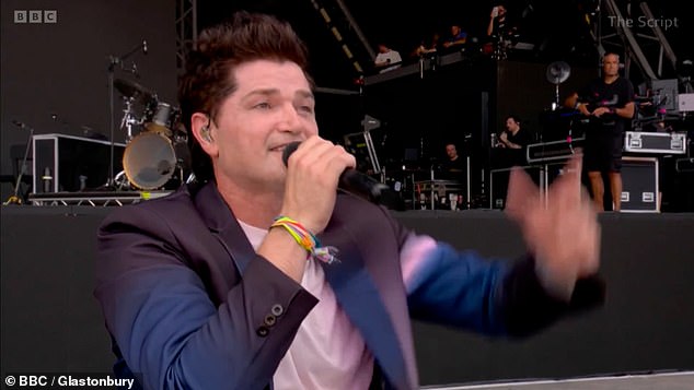 As the crowd cheered, he added: 'I know he's having a whiskey right now looking down on us. With that I'm gonna dedicate this song to him, this song is called If You Could See Me Now '