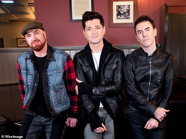 Mark [L], who was originally from Dublin, formed the successful rock band alongside frontman Danny [C] and drummer Glen Power [R] in 2001 [pictured in 2019]