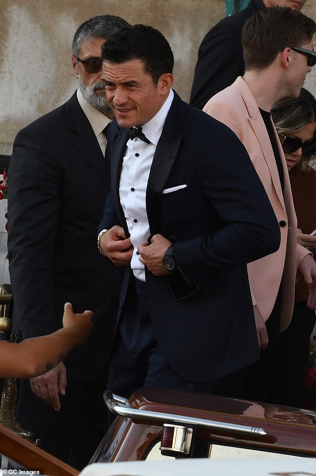 Orlando, who is reported to have recently split from Katy Perry, looked dapper for the occasion in a tux