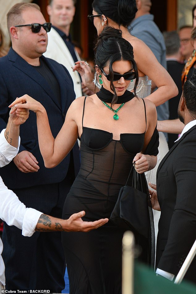 She added a pop of colour with her statement emerald jewellery as she wowed for the night