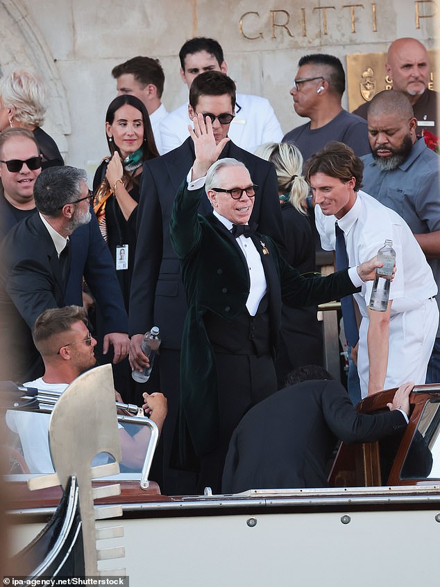 Tommy Hilfiger waves as he boards his boat to the wedding