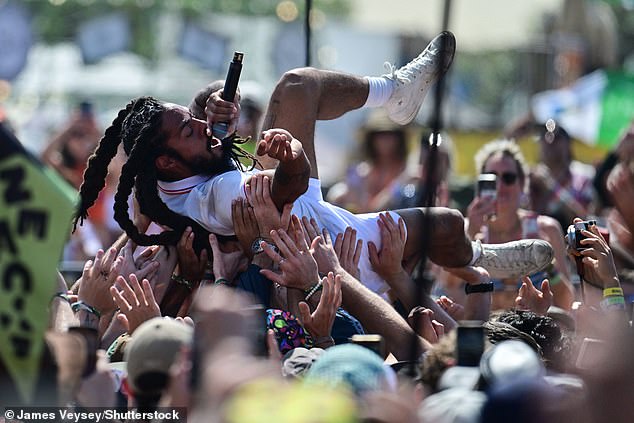 The duo were seen crowdsurfing during their energetic performance on the West Holts stage