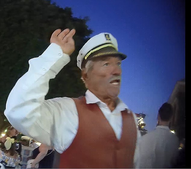 A 'pushy' worker at Eat Lovers Taverna dressed as a captain standing in the square urging tourists to come to the restaurant