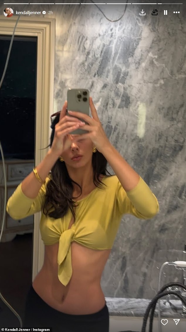 She was joined by sister Kendall who flashed her abs in a daring top