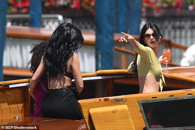 Kylie held onto Stormi as the boat left dock