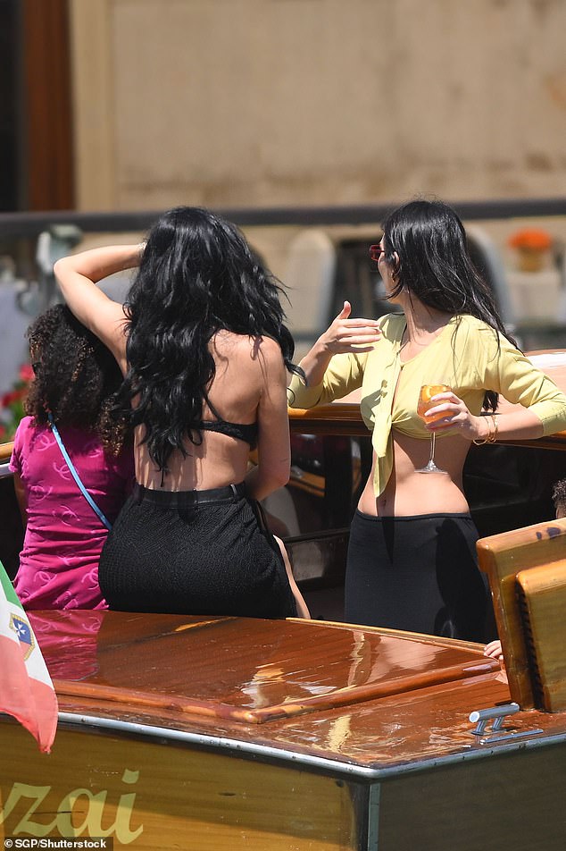 The trio all appeared in good spirits on the boat