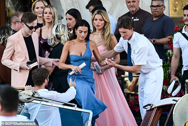 Sarah Jane and Brooks Nader are seen waiting to board a taxi boat in the Italian city of Venice during wedding celebrations