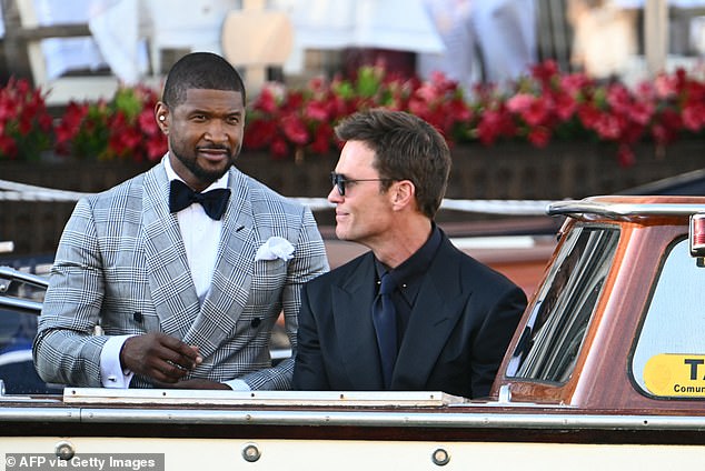 US singer Usher Raymond IVl (L) and US football player Tom Brady leave the Gritti Palace Hotel on the wedding day of Amazon founder Jeff Bezos with Lauren Sanchez, in Venice on June 27, 2025