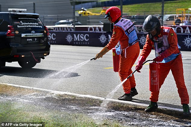 Track marshals were quick to extinguish the blaze after Hamilton's Ferrari ran wide