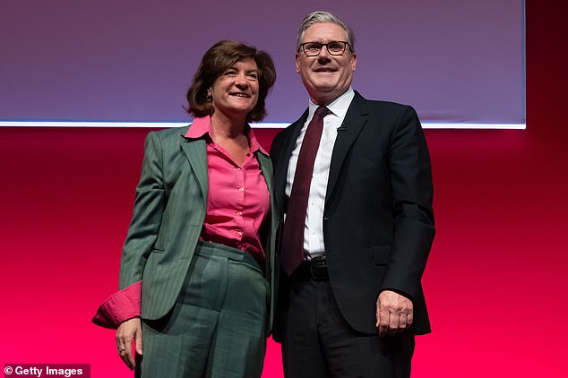Sir Keir Starmer hugs First Minister of Wales Eluned Morgan during the 2025 Welsh Labour party conference