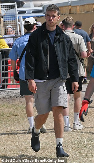 He styled his look with a smart jacket and wellington boots