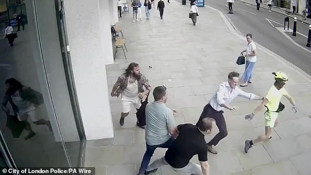 Pictured: CCTV footage that captured the moment Duarte attempted to flee from the scene. After giving a brief witness statement to Metropolitan Police officers, Alex said he then returned back to his office to continue his normal day at work