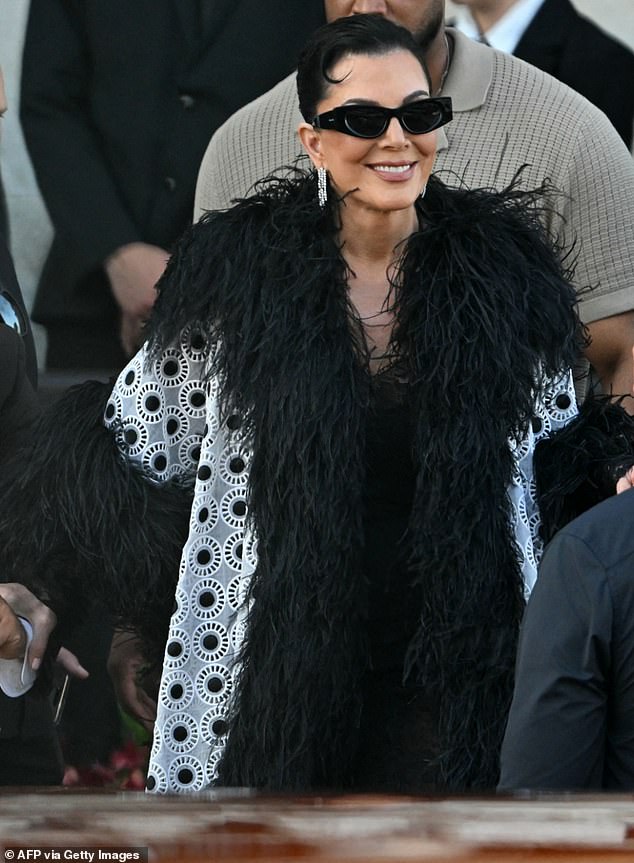 The matriarch of the Kardashian-Jenner clan, Kris Jenner, 69, appeared on the third day of wedding festivities channeling her inner Cruella de Vil in a black and white ensemble. Her look featured a black fringe trim over a white coat with small circles cut out. She matched the look with sleek sunglasses and drop down earrings