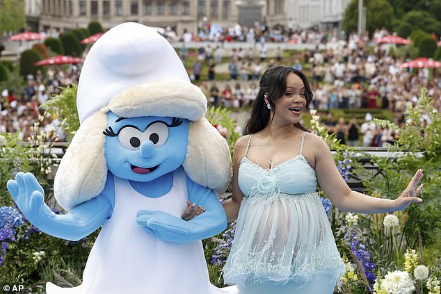 RiRi was in good spirits as she posed next to a Smurfette at the event, looking happier than ever