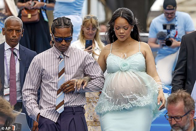 A$AP - whose real name is Rakim Mayers - linked her arm as they walked side-by-side into the venue
