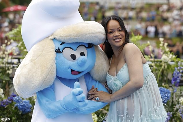 Rihanna's appearance at Paris Fashion and the Smurfs premiere comes after her father's cause of death was tragically revealed on Thursday