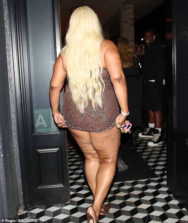 She opted for a notably sheer dress that was cut off at mid-thigh, teamed with matching heels and a dazzling necklace