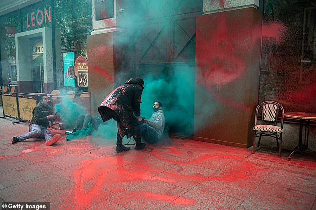 Activists from Palestine Action let off smoke grenades, spray blood red paint and grapple with a security guard outside the offices of Elbit Systems in 2022