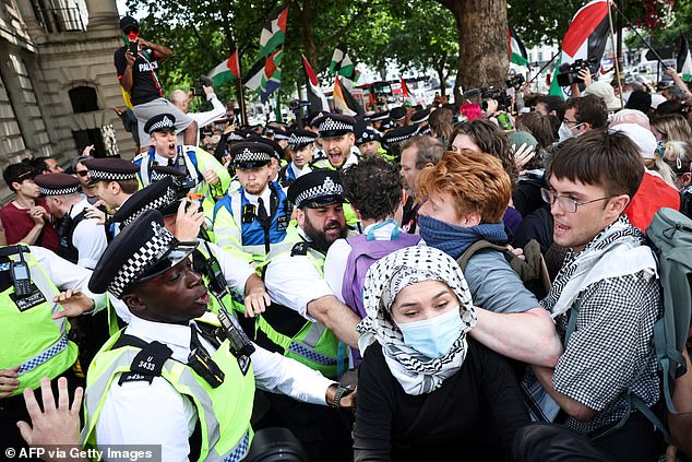 Protestors and Met Police officers clashed during a rally in support of Palestine Action