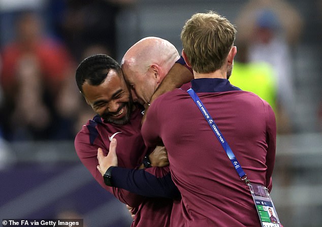 Manager Lee Carsley (centre) pictured hugging coach Ashley Cole (left) after the final whistle