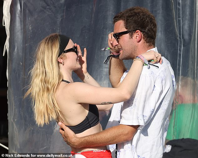 The glamorous couple looked very much in love in Glastonbury's VIP hospitality bar, holding hands and laughing with friends