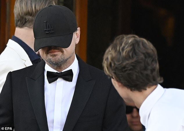 Although hiding from the cameras, Leonardo diCaprio joined in the celebrations