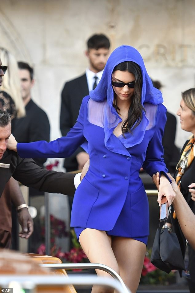It's not only the Kardashian clan at the Bezos wedding who are kitted out in mini dresses ¿ they¿re springing up everywhere. After years of women in wafting midis, the mini is back. Pictured: Kendall Jenner leaving in Venice for Jeff Bezos and Lauren Sanchez Bezos' wedding