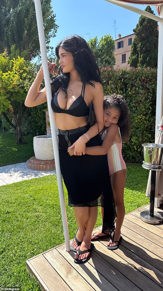 Jenner uploaded this sweet snap of Stormi embracing her in the sunshine