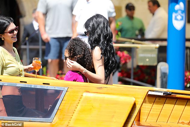 Jenner sweetly stroked her daughter's hair