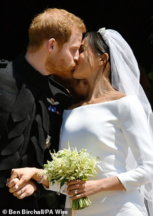 Harry and Meghan kissing as they leave St George's Chapel in Windsor Castle after their wedding