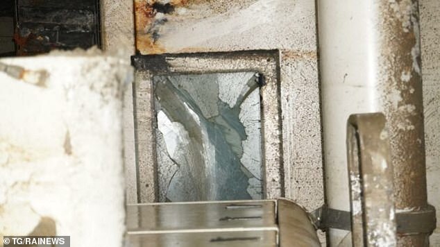 Other haunting photos show a hatchway leading down from the deck, and cracked glass