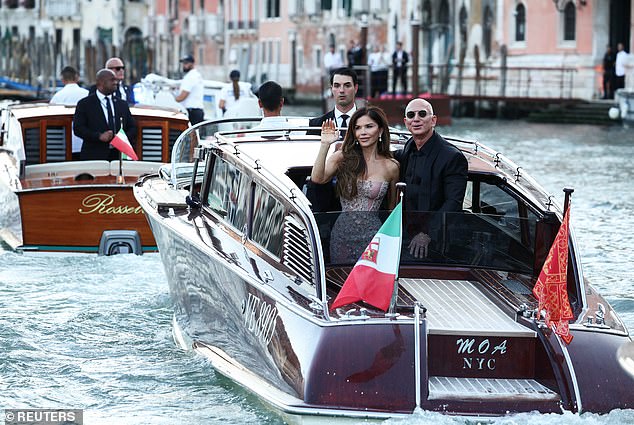 A flotilla of paparazzi boats followed Jeff and Lauren and other VIPs as they made their way along the lagoon in private water taxis