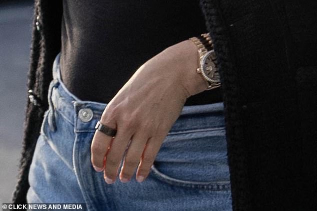 A wedding ring was missing from Holly Valance's hand as she arrived at Heathrow's Terminal 5