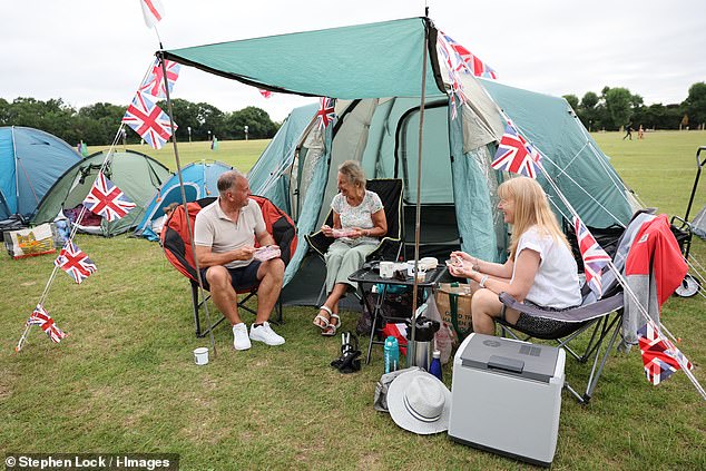 Draped in Union Jacks, many were seen cheerfully chatting with fellow fans as they settled in for the long wait ahead