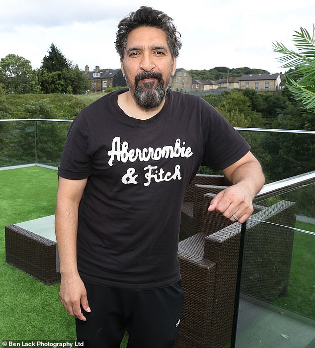 Shokat Khan, 55, excavated tonnes of soil from his garden in Bradford to create the three-storey, white-rendered annexe, designed as a home office , games room, gym and rooftop terrace