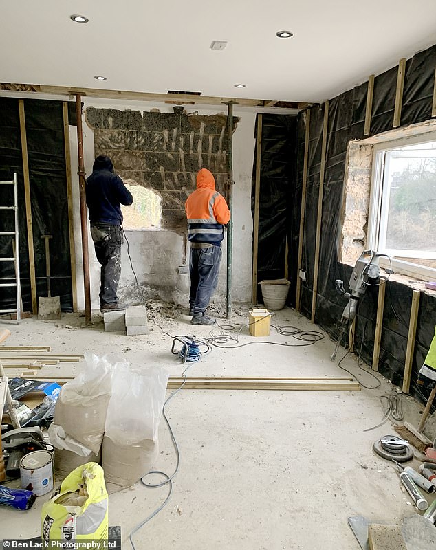 Showing Mail Online the unfinished interior - currently used for storage and a makeshift gym - Mr Khan said he had grand plans for the annexe, including a kitchenette, toilet, jacuzzi, and a full-size pool table
