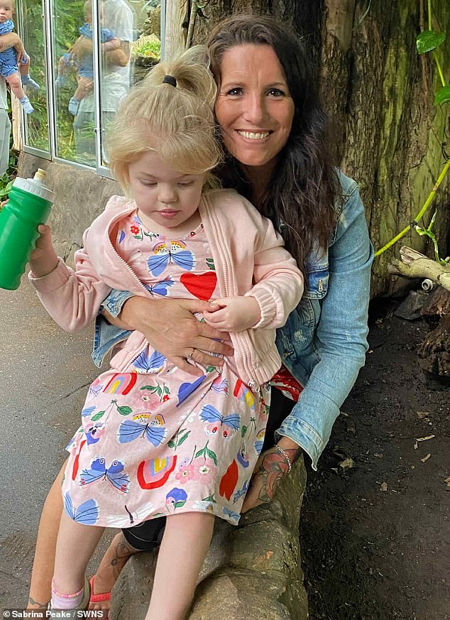 Esmay Ford was diagnosed with 'childhood Alzheimer's' after she stopped talking aged two despite being a 'healthy' baby who enjoyed dancing and interacting with others; pictured with her grandmother, Sabrina