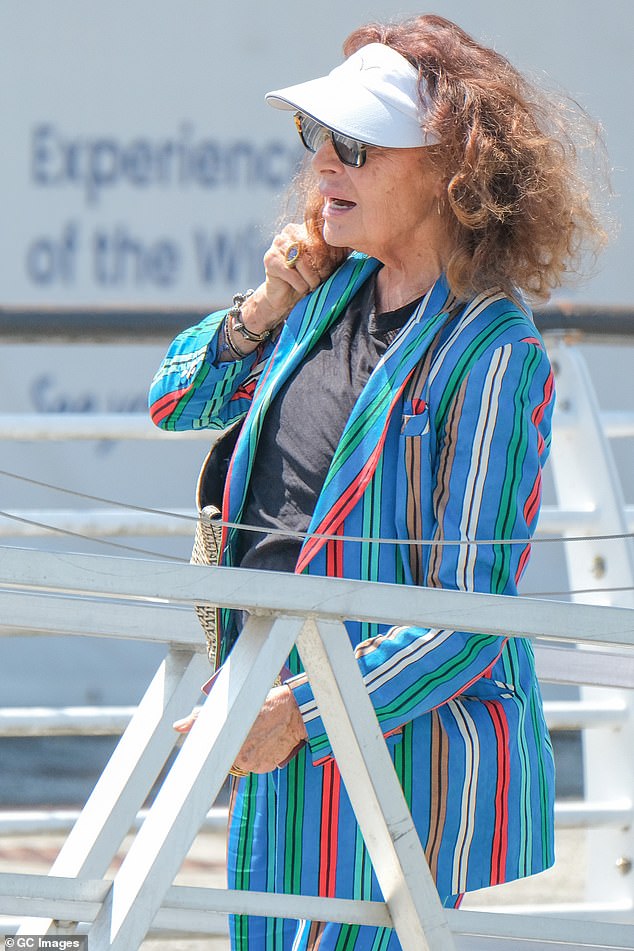 Diane Von Furstenberg, 78, appeared to be rewearing the outfit she arrived in - opting to don a bright blue pants and blazer combo adorned with an array of colored stripes, designed by her own brand of course. She then perched a white sun visor atop her curly tresses
