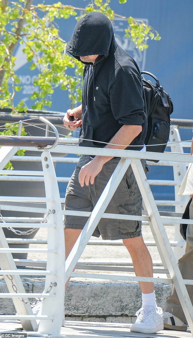 Once again, Leonardo DiCaprio, 50, attempted to go incognito as he opted to wear his hood up to shield his face from view. He paired the sweatshirt with a pair of khaki cargo shorts and white trainers