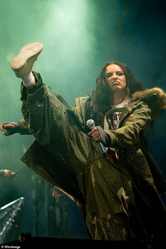 Flashing a glimpse of her toned midriff, JADE layered a khaki parka over her shoulders and donned an extravagant faux-fur hat, before delivering a high-energy set to the excited crowd