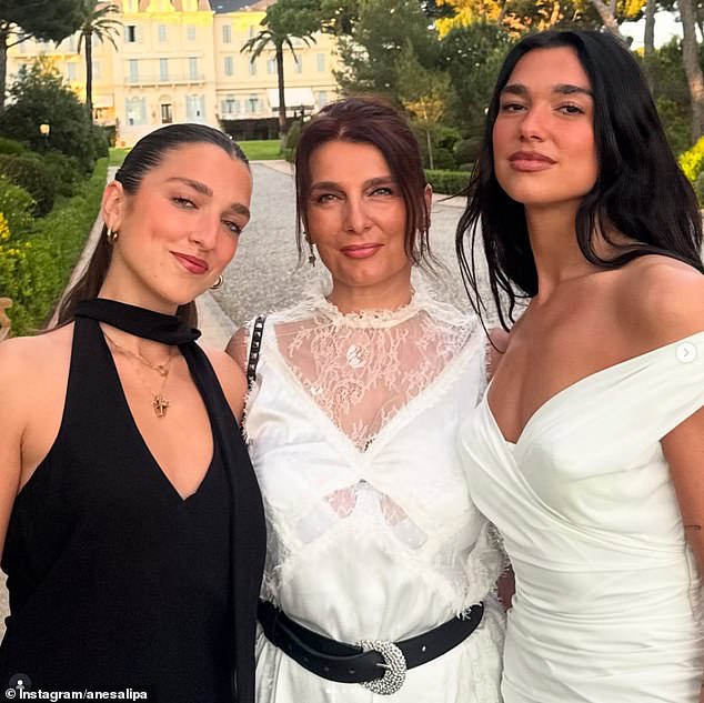 Once a trainee lawyer, Anesa says her biggest accomplishment is being a mother - pictured centre, with daughters Rina (left) and Dua (right)