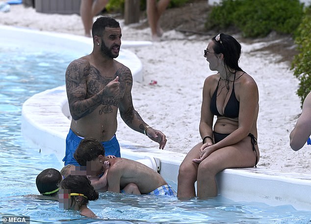 The couple have been making the most of their time together on a five-star holiday to Disneyworld, where onlookers claimed the family seemed 'extremely happy'