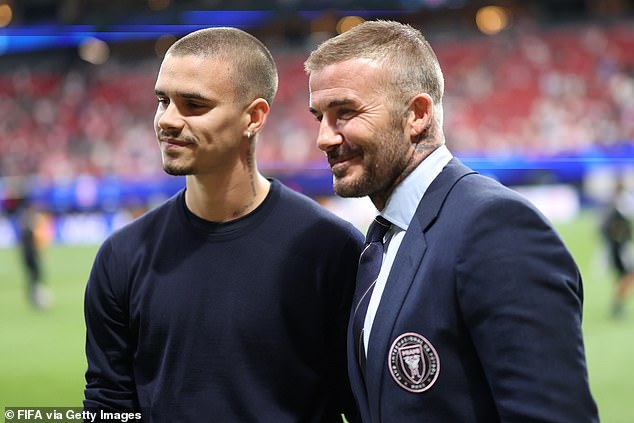 Romeo Beckham (left), one of the football legend's four children, was also at Sunday's game