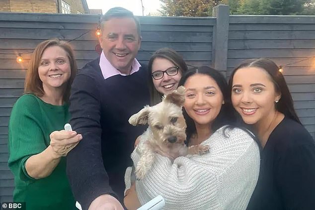 John with Amy (standing next to her father) and his wife, Carol, and daughters, Louise (second from right, who ran a dog-grooming business) and Hannah