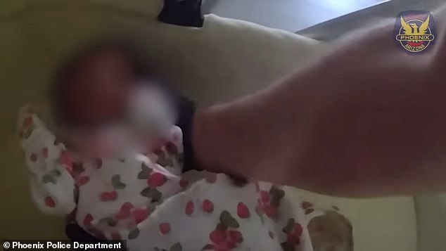 Phoenix Police have released harrowing bodycam footage of the moment cops rescued the tiny baby as their mother lay dead beside them