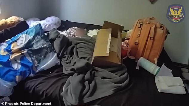 Cops found the infant wrapped in blankets on a bed, where the mother's body was also found