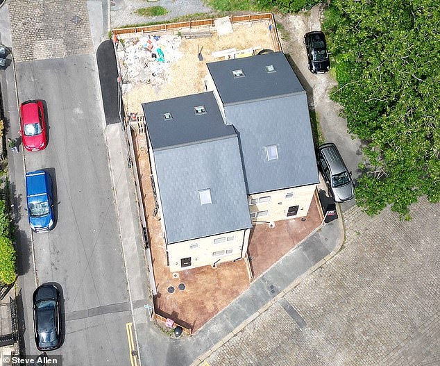 Now locals are demanding action over the 'cowboy' development, which they claim towers over surrounding heritage cottages