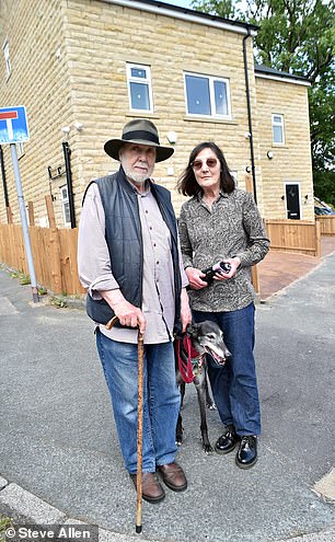 Locals Les and Janet Megson outside the two new houses in Bradford